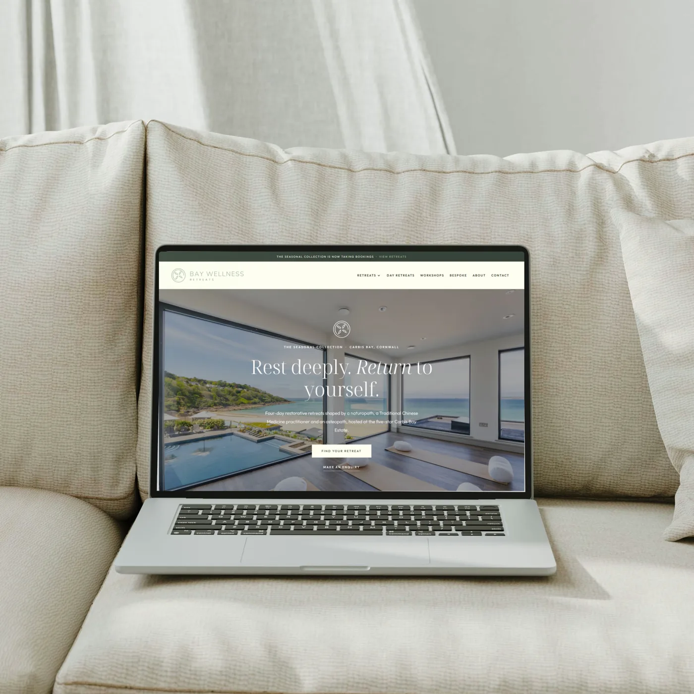 Bay Wellness Retreats website on a laptop