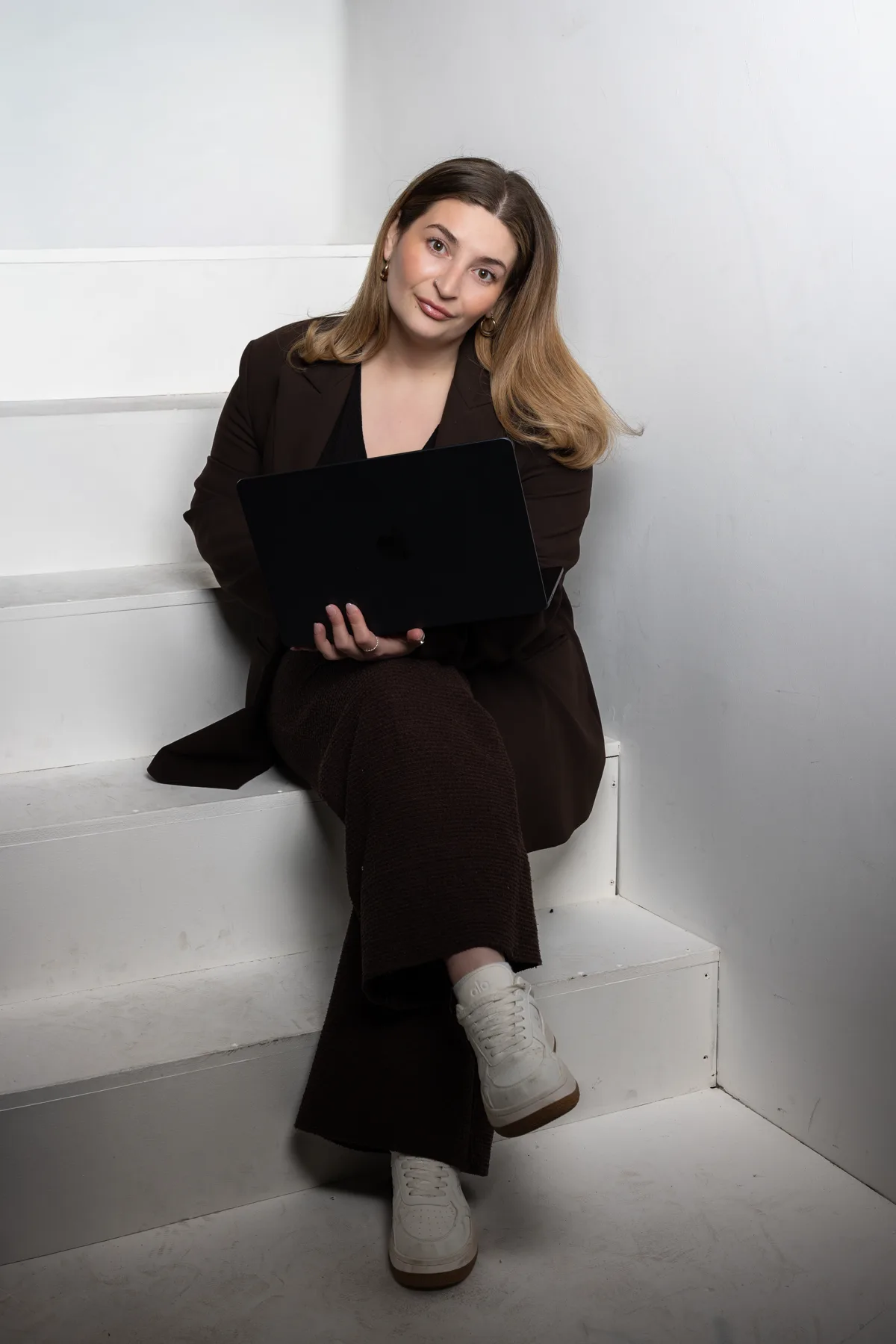 Jade sitting on the stairs, founder of Design With Bloom