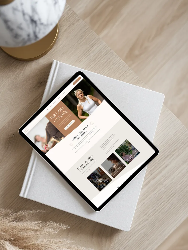 Hair by Aime website shown on a tablet